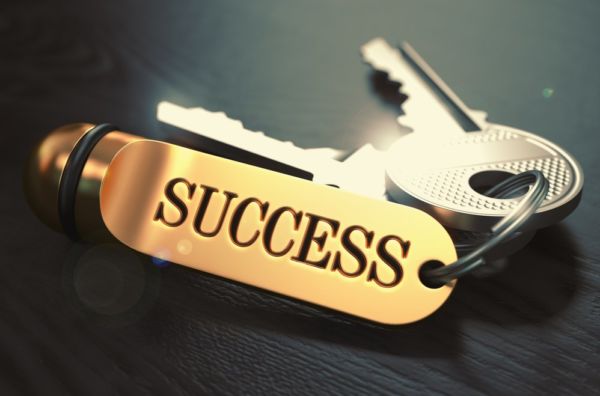 Keys-to-Success-Concept-on-Golden-Keychain-over-Black-Wooden-Background ...